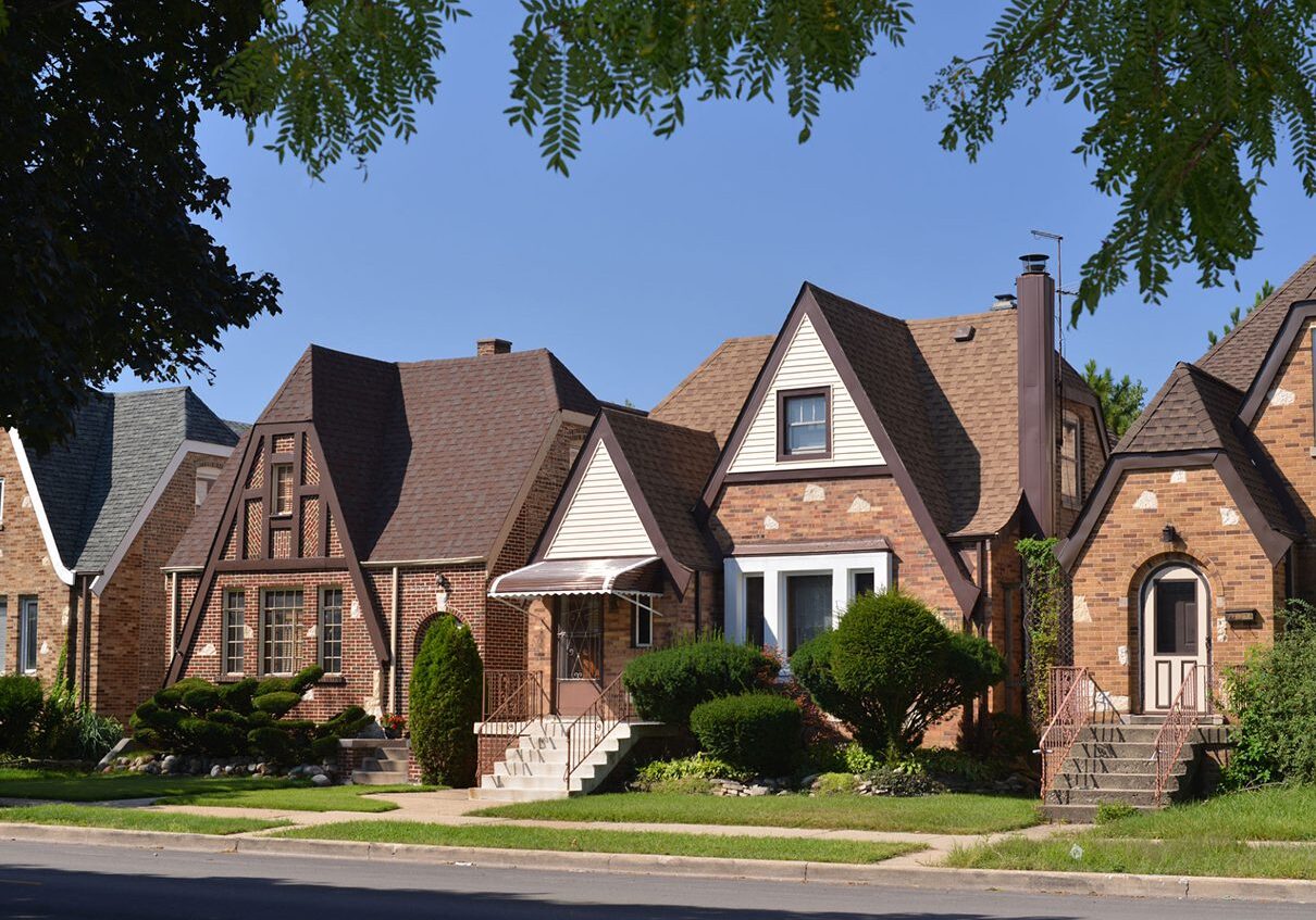Row of charming Tudor-style brick houses.