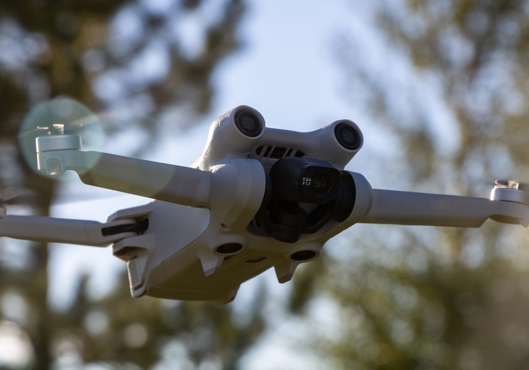 DJI Mini 3 Pro Aerial 4k Quadcopter drone close up in Sunlight flying in the air close up